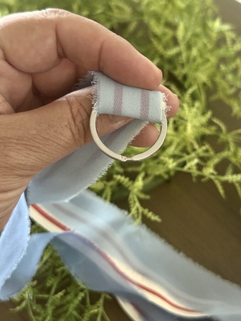 Tie a ribbon tail bundle on a wreath