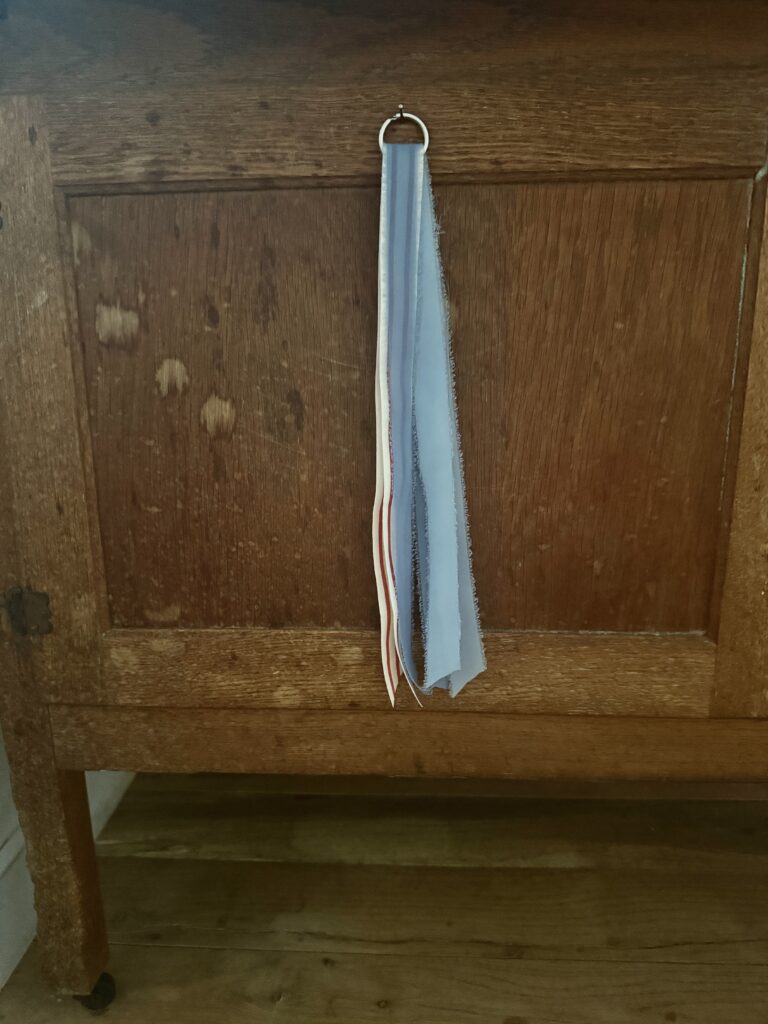 Tie a ribbon tail bundle on a wreath