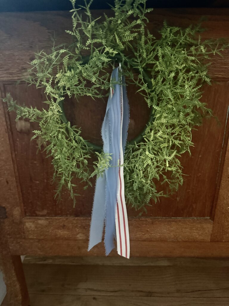 Tie a ribbon tail bundle on a wreath