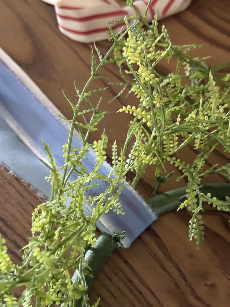 Tie a ribbon tail bundle on a wreath