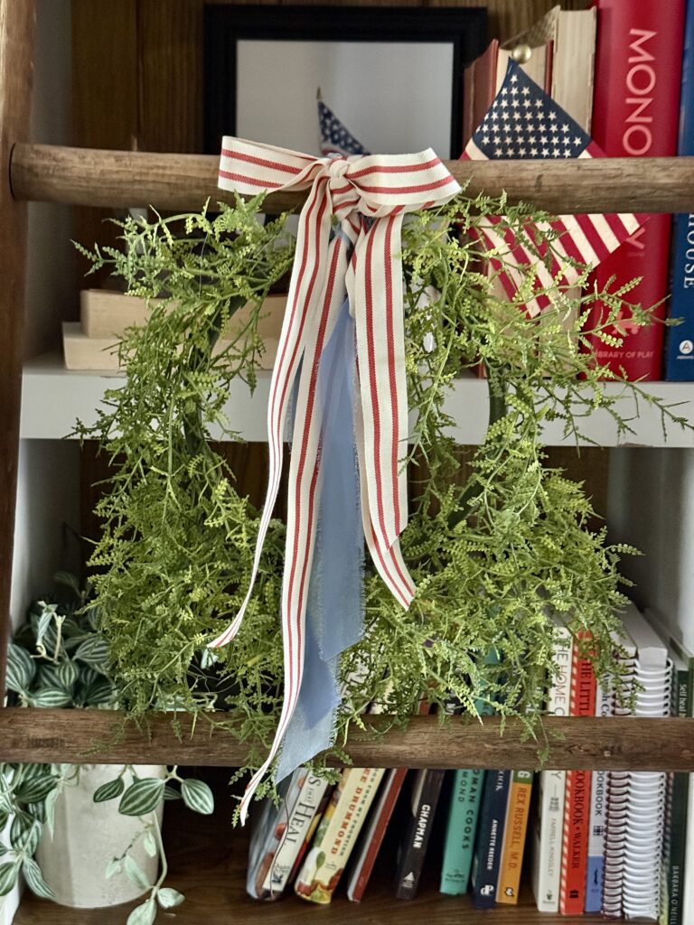 Tie a ribbon tail bundle on a wreath